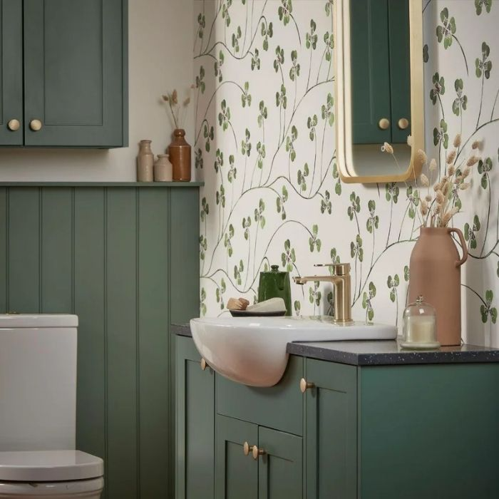 Green cabinets with floral wallpaper