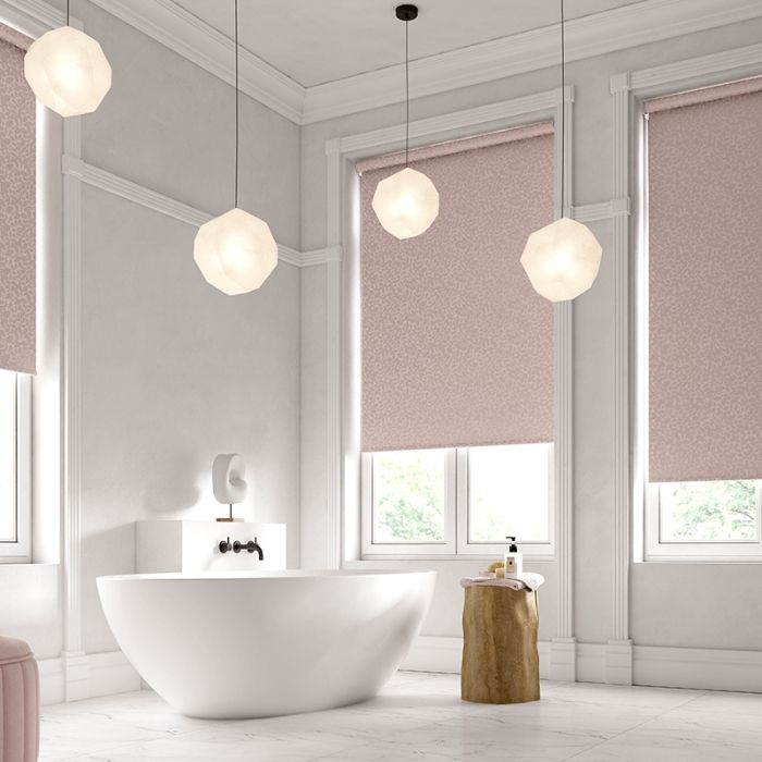 Three windows with blinds in a luxurious bathroom