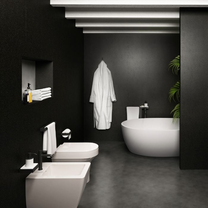 Matte black walls with sleek fixtures in a contemporary bathroom