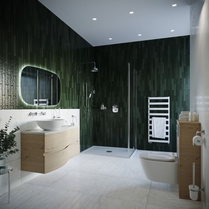 Dark green tiles with light flooring in family bathroom