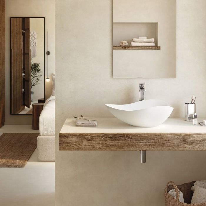 Sleek white sink on a rustic wooden countertop