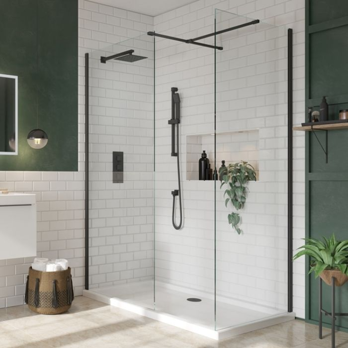 White metro tiles with a raised shower tray in a green bathroom