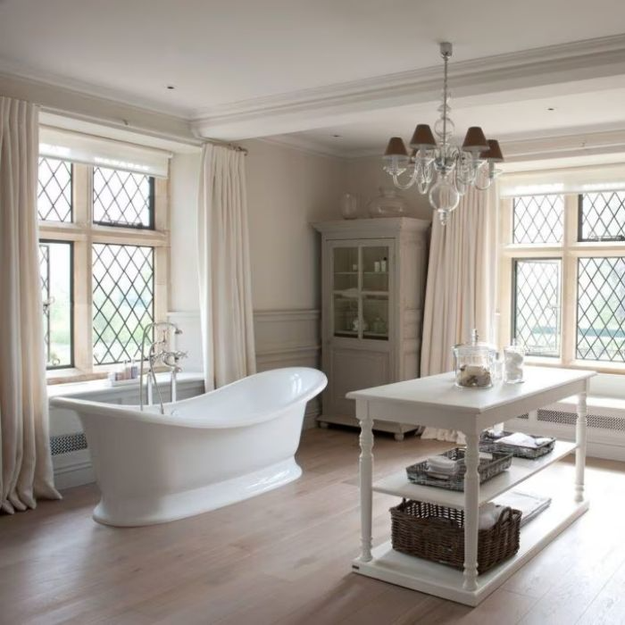 Traditional bathroom with lattice windows and freestanding bath