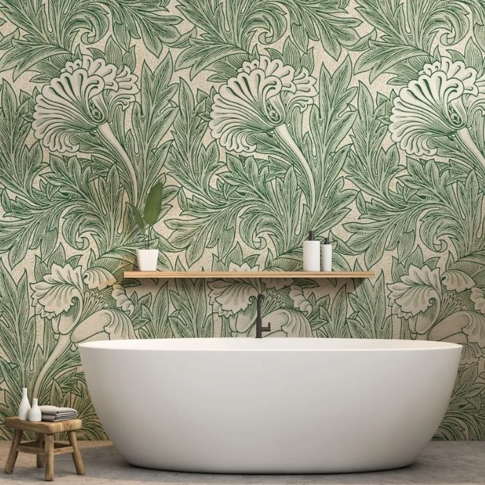 Green and cream botanical wallpaper with a white bathtub