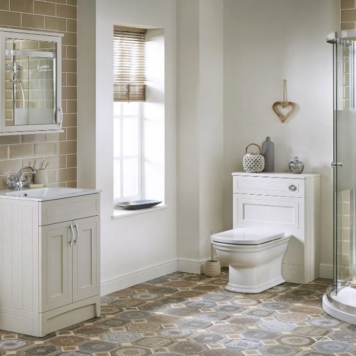 Patterned floor tiles in a light, airy family bathroom