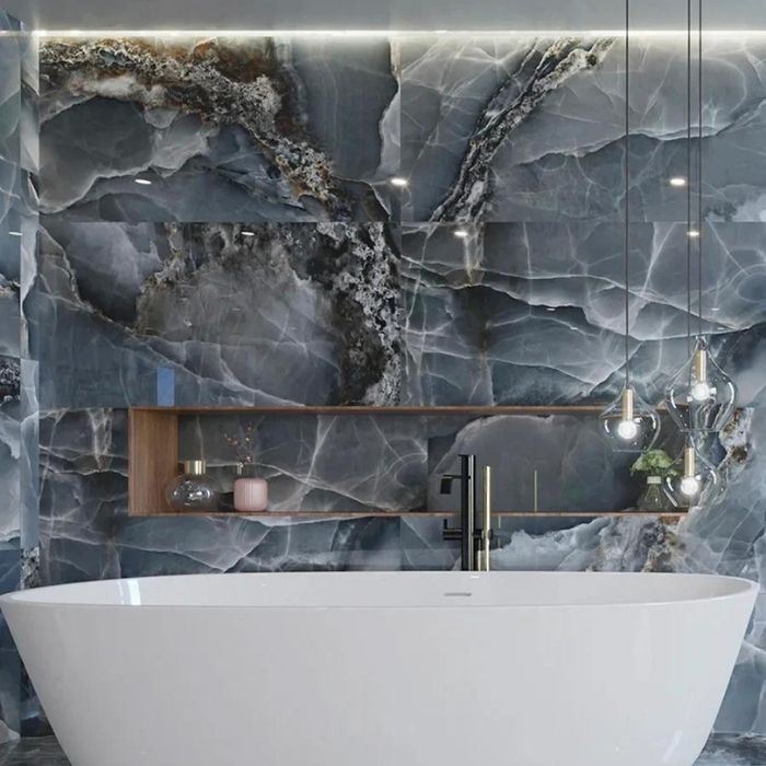 Dark blue marble effect tiles in a luxury bathroom