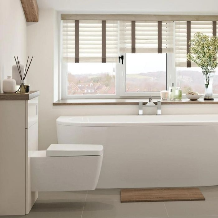 Modern bathroom with white blinds over a large window