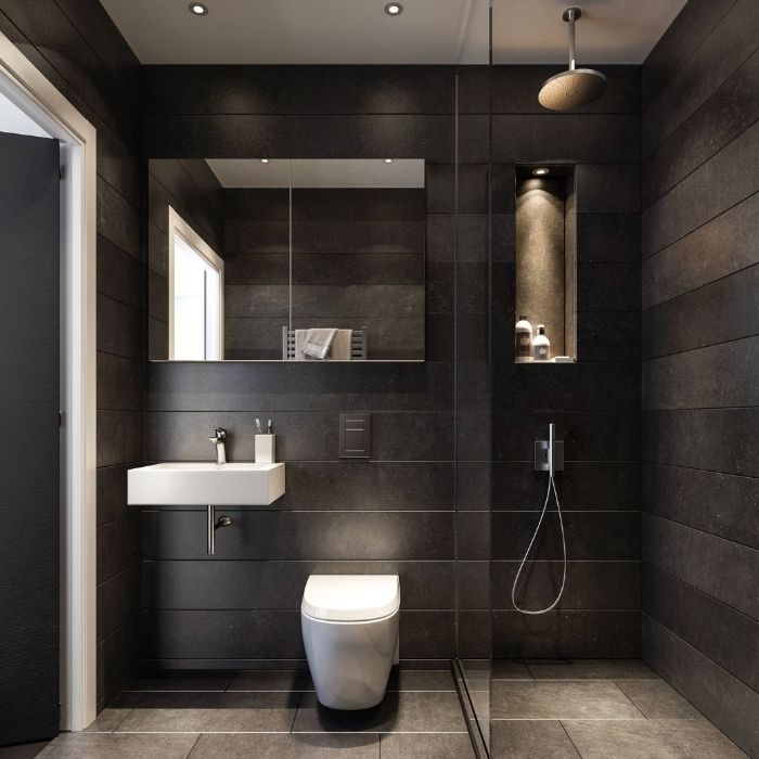 Black horizontal tiles in a sleek, compact bathroom