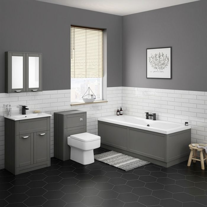 Grey painted walls with white subway tiles and black hexagon floor tiles