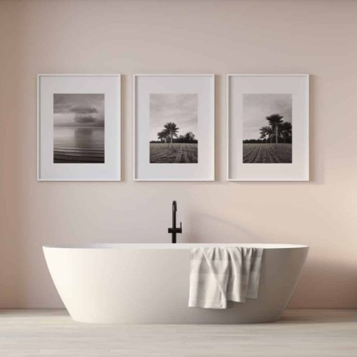 Minimalist bathroom with soft pink walls and black fixtures