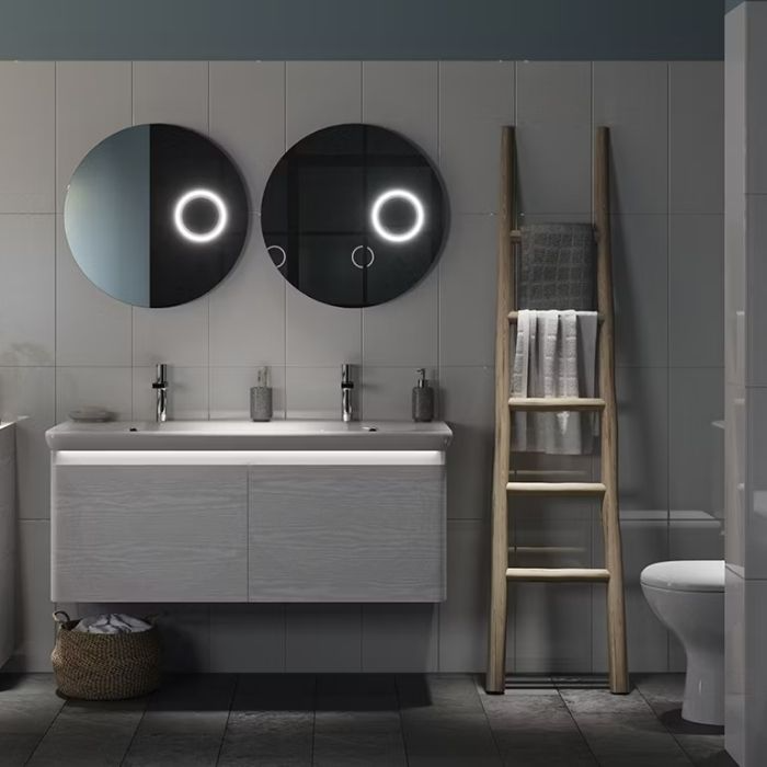 Modern bathroom with round mirrors and wood ladder