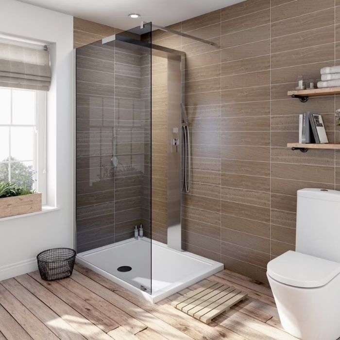 Wood-effect tiles with a raised shower tray in a bright bathroom