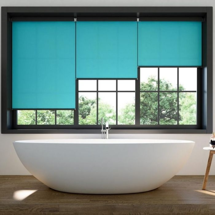 Large black-framed window with turquoise blinds in bathroom