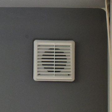 Bathroom fan installed to reduce condensation and moisture buildup.
