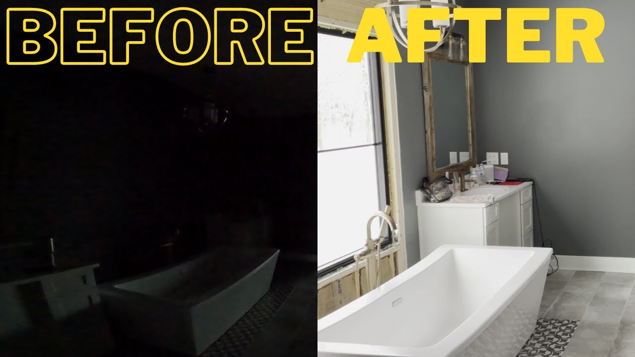 Dark bathroom transformed with natural light through window installation.