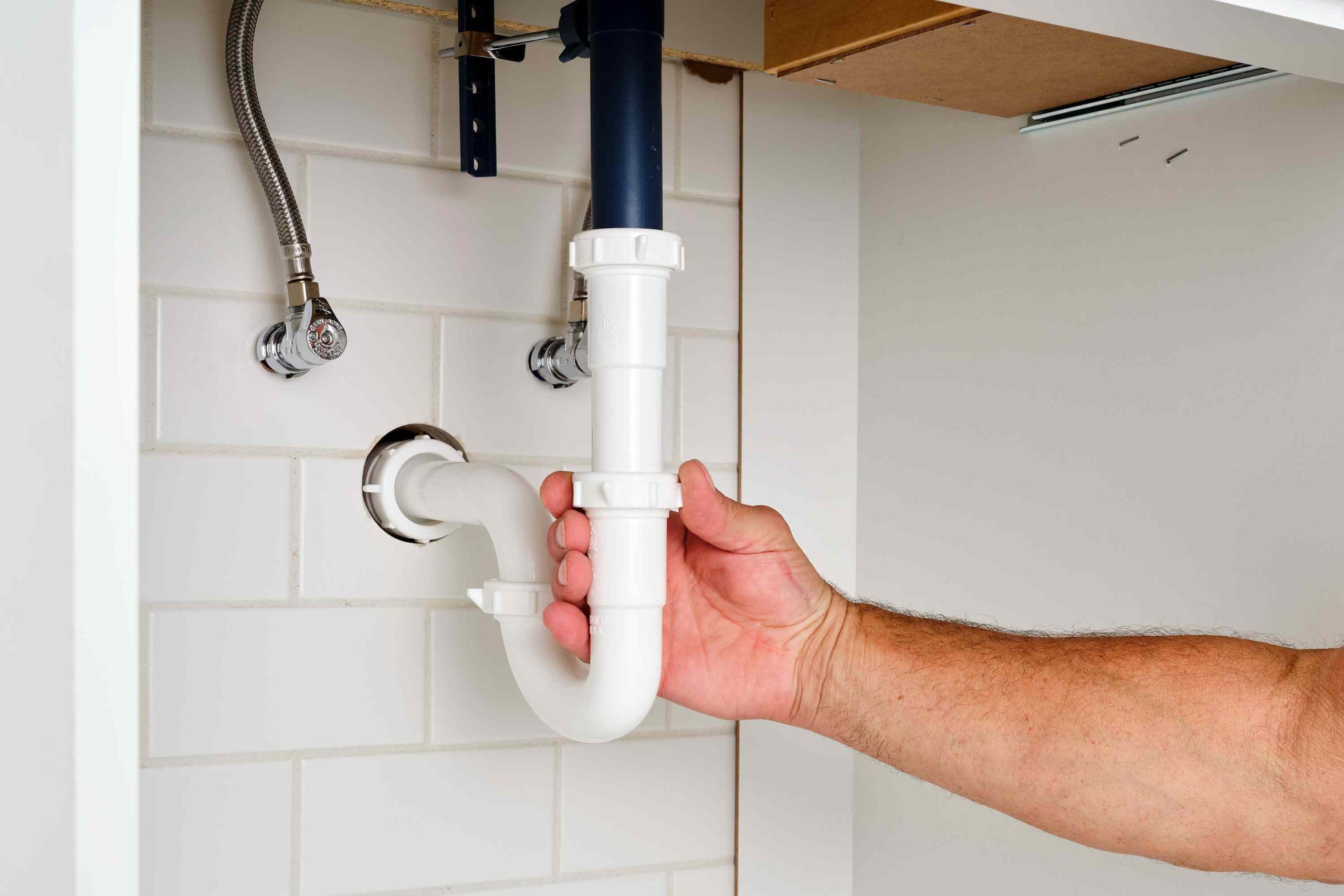 Fixing bathroom drain pipe to eliminate unpleasant odors.