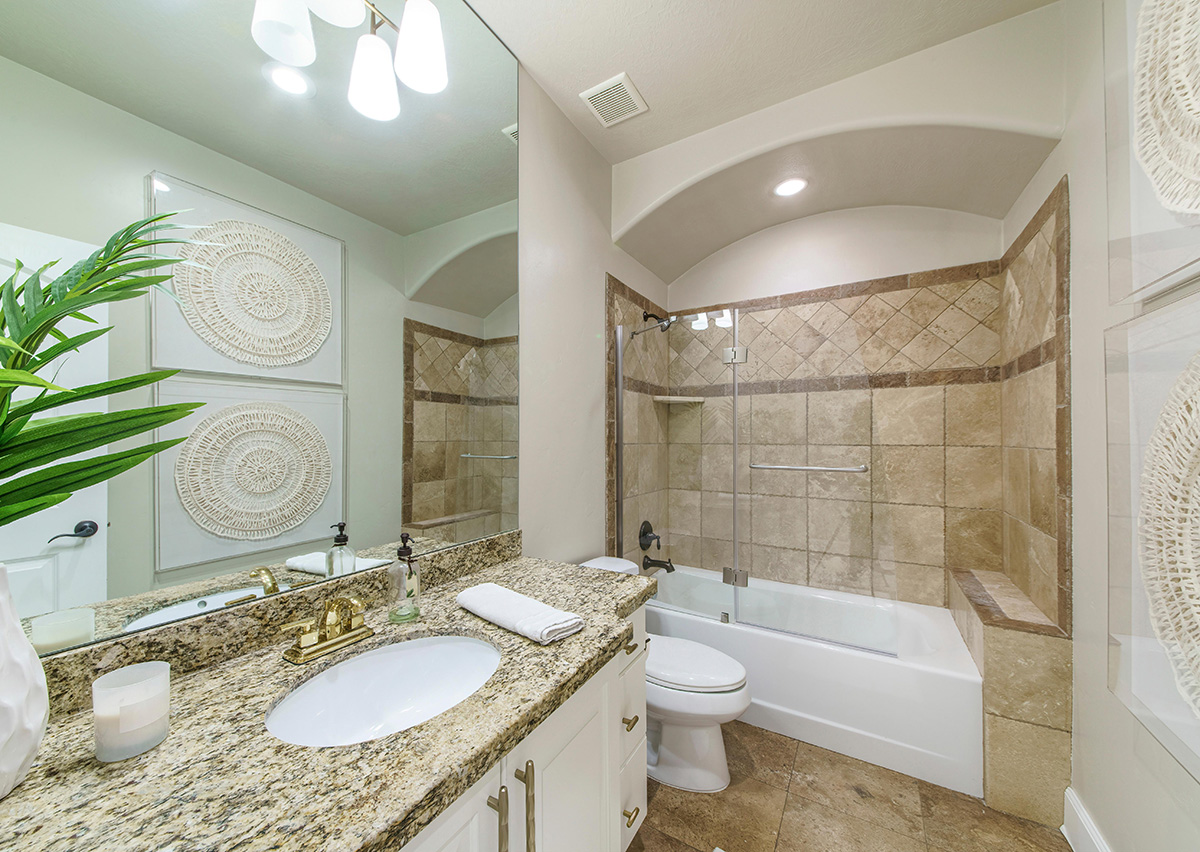 Modern bathroom with elegant tiles and ambient lighting, no window.