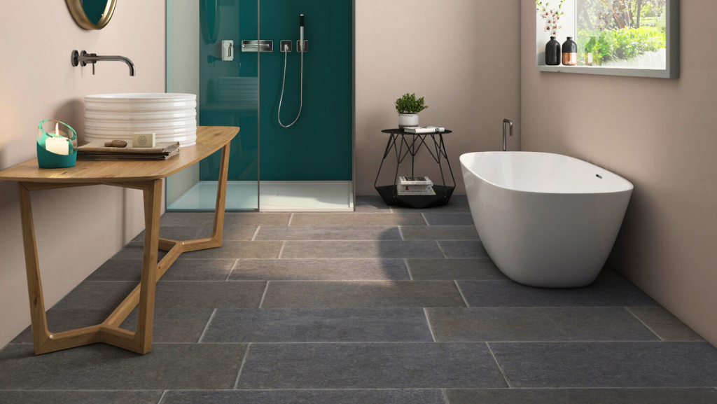 Modern bathroom with sleek tiles and stylish freestanding bathtub.