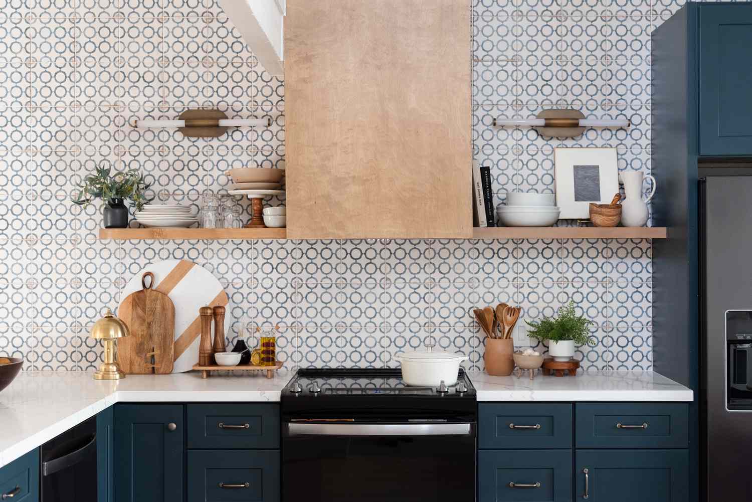 Modern kitchen with geometric tiles and stylish wooden accents.