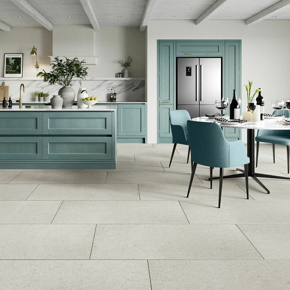 Sleek modern kitchen with elegant tiled flooring and teal accents.