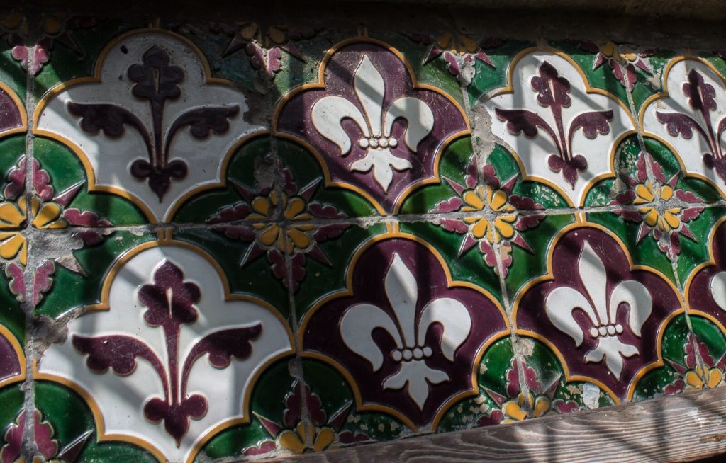 Victorian fleur-de-lis tiles on a church window sill